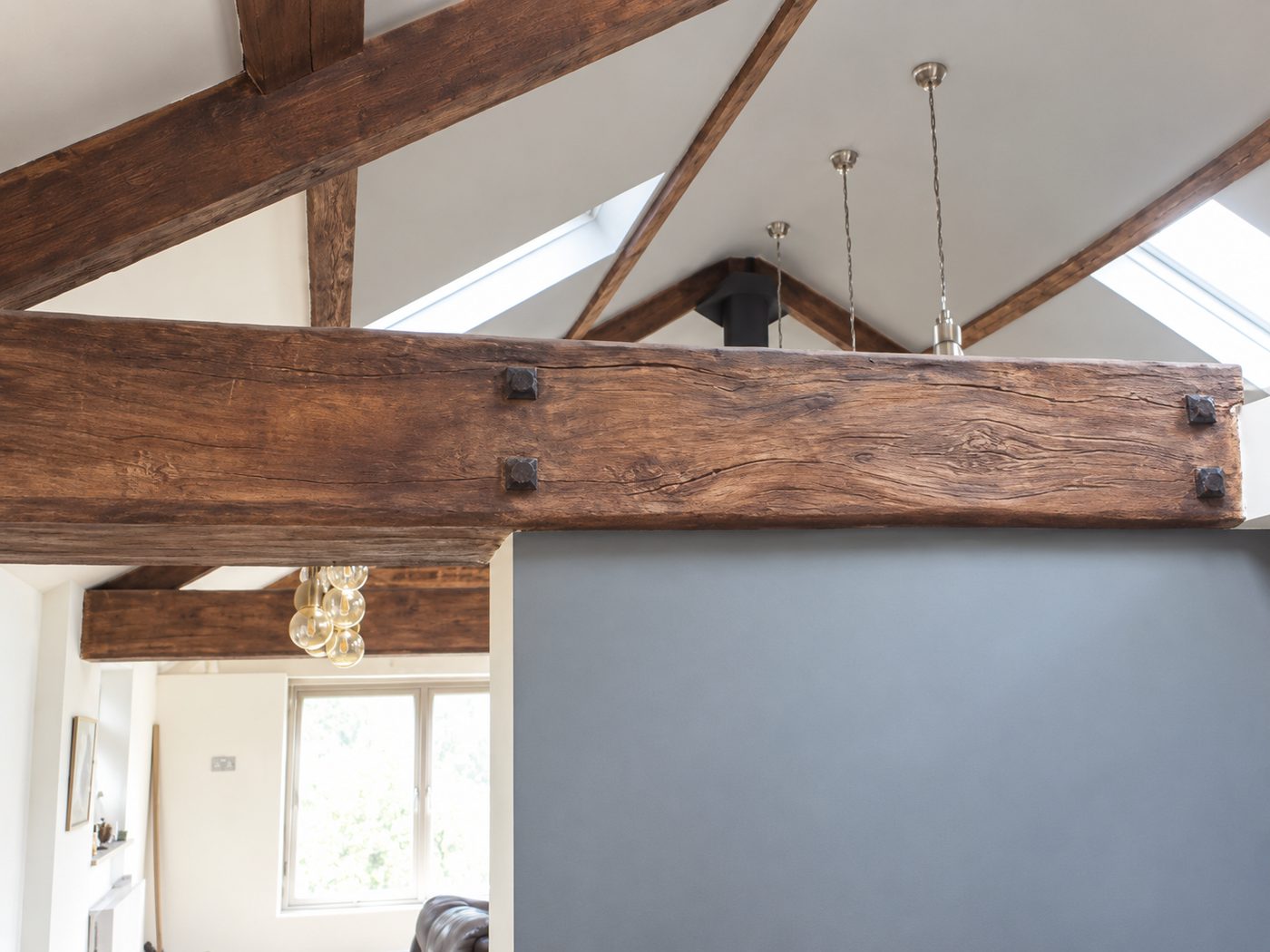 Hand-carved plaster beam with oak-effect peg detail